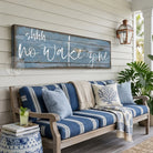 Bring laid-back lake life to your space with Toe Fish Art's "Shhh… No Wake Zone" sign. Featuring a weathered rustic blue finish, hand-lettered white typography, and the look of reclaimed wood, this timeless but trendy design adds relaxed coastal vibes. Choose between premium framed canvas or durable outdoor metal. Toe Fish Art makes artisan wall art with American materials. Proudly Made in the USA, each piece is expertly constructed with genuine craftsmanship, heritage quality, and rustic charm.