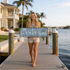 Bring laid-back lake life to your space with Toe Fish Art's "Shhh… No Wake Zone" sign. Featuring a weathered rustic blue finish, hand-lettered white typography, and the look of reclaimed wood, this timeless but trendy design adds relaxed coastal vibes. Choose between premium framed canvas or durable outdoor metal. Toe Fish Art makes artisan wall art with American materials. Proudly Made in the USA, each piece is expertly constructed with genuine craftsmanship, heritage quality, and rustic charm.