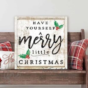 Toe Fish Art Vintage "Have Yourself a Merry Little Christmas" Rustic Cottage Christmas Winter Holiday Season Wall Decoration square-shaped sign. Winter Holiday Seasonal Wall Decor painting. Primitive Country Christmas sign handcrafted in durable high-quality stretched canvas, or framed canvas with choice of frame colors, or outdoor weatherproof solid aluminum metal, handmade in the USA from start to finish! Beautiful, nostalgic and timeless seasonal holiday wall decor. Handcrafted in the USA by ToeFishArt, and built to last a lifetime by the Toe Fish Art family artisans. This beautifully designed festive sign comes in three color styles to fit your style: Timeworn White, Rustic White or Rustic Black, all with the favorite saying "Have Yourself a Merry Little Christmas" adorned with red and green holly berries and leaves. This sign adds unique eye-catching decor indoors or outdoors. Add instant outdoor holiday curb appeal! Christmas welcome entryway porch or living room fireplace hearth or fireplace mantel wall hanging or shelf sitter. Original, custom, personalized wall decor signs. Canvas, Wood or Metal. Rustic modern farmhouse, cottagecore, vintage, retro, industrial, Americana, primitive, country, coastal, minimalist. Toe Fish Art is a USA small family woman owned business making beautiful decor since 1997.