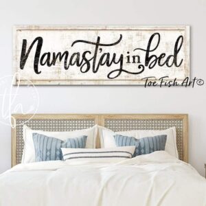 Namast'ay In Bed Sign handmade by ToeFishArt. Original, custom, personalized wall decor signs. Canvas, Wood or Metal. Rustic modern farmhouse, cottagecore, vintage, retro, industrial, Americana, primitive, country, coastal, minimalist.