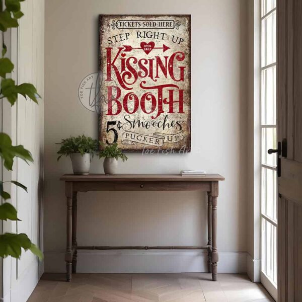 Toe Fish Art’s vintage cottage-style wall art showcases a rustic Kissing Booth sign, perfect for Valentine’s Day. Inspired by old-time fairs and carnivals, this vertical piece features a charming design advertising “5-cent smooches” in a distressed red, white, and black color palette for an authentic, nostalgic touch. This wall decor is available in numerous sizes from small to huge, and several material choices suitable for your space. Blending rustic primitive country charm with cottage farmhouse style, this handcrafted artwork is available in durable high-quality framed canvas or outdoor weatherproof solid aluminum metal. Proudly made in the USA, each piece is designed to last a lifetime by the artisans at Toe Fish Art. This beautiful artwork enhances any decor, and makes the perfect Valentine Gift, adding eye-catching appeal indoors or outdoors. It’s perfect for display in a porch, entryway, patio, lanai, deck, veranda, living room, fireplace hearth or mantel, dining room, or bedroom, or as a shelf sitter. A special reminder of the season of love, this artwork fits various styles, including rustic modern farmhouse, cottagecore, vintage, retro, industrial, Americana, primitive, country, coastal, and minimalist. Toe Fish Art is a small family, woman-owned business, creating beautiful decor for almost three decades, since 1997!