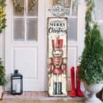 Merry Christmas Nutcracker Toy Soldier Doll Vertical Porch Front Door Entryway Welcome Holiday Decoration Canvas or Outdoor Metal Sign handmade by ToeFishArt. Original, custom, personalized wall decor signs. Canvas, Wood or Metal. Rustic modern farmhouse, cottagecore, vintage, retro, industrial, Americana, primitive, country, coastal, minimalist.