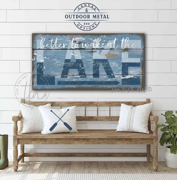 ToeFishArt Better to Wake at the Lake Indoor-Outdoor Metal or Canvas Personalize-able rustic coastal farmhouse sign, in beautiful vintage blues, handmade by ToeFishArt. Outdoor Exterior Commercial-Grade durable Metal Sign handmade in the USA and built to last a lifetime by the Toe Fish Art family artisans. Add your personalized Lake Name and State to this beautiful blue and white artwork for unique eye-catching decor indoors or outdoor curb appeal. Original, custom, personalized wall decor signs. Canvas, Wood or Metal. Rustic modern farmhouse, cottagecore, vintage, retro, industrial, Americana, primitive, country, coastal, minimalist.