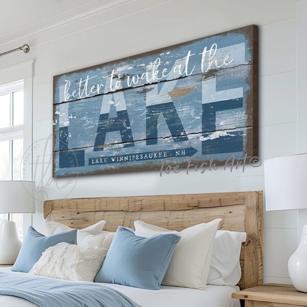 ToeFishArt Better to Wake at the Lake Indoor-Outdoor Metal or Canvas Personalize-able rustic coastal farmhouse sign, in beautiful vintage blues, handmade by ToeFishArt. Outdoor Exterior Commercial-Grade durable Metal Sign handmade in the USA and built to last a lifetime by the Toe Fish Art family artisans. Add your personalized Lake Name and State to this beautiful blue and white artwork for unique eye-catching decor indoors or outdoor curb appeal. Original, custom, personalized wall decor signs. Canvas, Wood or Metal. Rustic modern farmhouse, cottagecore, vintage, retro, industrial, Americana, primitive, country, coastal, minimalist.