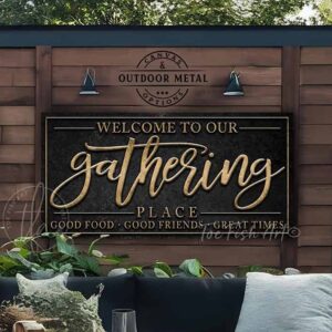 Toe Fish Art's Gathering Place Sign handcrafted to-order in the USA for you in Canvas or Outdoor Weatherproof Metal. Personalize-able sign with your family name, favorite saying or Welcome phrase. Swanky and stylish vibrant colors to enhance your decor - Vintage Slate Black with Rustic Gold Lettering. Custom quote options like Proudly Serving Whatever You Brought, Good Food Good Friends Great Times, Sit Long Talk Much Laugh Often, Come Gather at Our Table, Where Friends Become Family. This is the perfect piece for your indoor or outdoor dining room, patio, porch, deck, lanai, pergola, outdoor kitchen & bar area, kitchen nook, game room, bar & lounge or favorite entertaining space inside or outside! Handmade to-order in the USA by American small family woman-owned company ToeFishArt, doing business since 1997. Personalized Canvas or Outdoor Exterior Commercial-Grade Metal Sign handmade in the USA and built to last a lifetime by Toe Fish Art. Add your personal name or catch phrase to this beautiful artwork for unique, eye-catching appeal indoors or for your outdoor hangout space. Color options available too! Thousands of five star reviews! Featured in Better Homes & Gardens, Cottages & Bungalows, and Farmhouse Style magazines. We make original, custom, personalized wall decor signs and wall art. Handcrafted in your choice of canvas, framed canvas, shiplap hardwood or outdoor metal. Choose from rustic, modern cottage farmhouse, cottagecore, vintage, retro, industrial, Americana, primitive, country, coastal and minimalist contemporary styles.