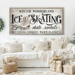 Toe Fish Art Vintage Nostalgic Winter Wonderland Ice Skating Canvas or Outdoor Metal Personalize-able Skate Rentals Sign. Rustic Cottage Country Christmas Wall Decor, handmade in the USA from start to finish! Stylish and timeless seasonal winter wall decor in antique winter white and black. Handmade in the USA by ToeFishArt, and built to last a lifetime by the Toe Fish Art family artisans. This beautiful original nostalgic winter ice skating sign adds unique eye-catching decor indoors or outdoors. Great outdoor holiday curb appeal! Cute and clever decor for your outdoor fire pit. Christmas welcome entryway porch or living room fireplace mantel wall hanging or shelf sitter. Original, custom, personalized wall decor signs. Canvas, Wood or Metal. Rustic modern farmhouse, cottagecore, vintage, retro, industrial, Americana, primitive, country, coastal, minimalist.