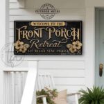 Toe Fish Art's original cottage style Front Porch Retreat sign handcrafted to-order in the USA for you in stunning Outdoor Weatherproof Metal. Personalize-able sign with your family name and established date, favorite saying or Welcome phrase. Swanky and stylish vibrant colors to enhance your outdoor living space decor. Vintage Slate Black with Rustic Gold Lettering. Beautiful design incorporating hibiscus flowers artwork. Custom quote options like Sit-Relax-Stay Awhile, Proudly Serving Whatever You Brought, Sipping Grilling Chilling, Relax & Enjoy, Where Wasting Time is Time Well Spent. This is the perfect piece for your indoor or outdoor entryway lounging space. Perfect for hanging above your porch swing! Handmade to-order in the USA by American small family woman-owned company ToeFishArt, doing business since 1997. Personalized Outdoor Exterior Commercial-Grade Metal Sign handmade in the USA and built to last a lifetime by Toe Fish Art. Add your personal name or catch phrase to this beautiful artwork for unique, eye-catching curb appeal for your outdoor hangout space. Thousands of five star reviews! Featured in Better Homes & Gardens, Cottages & Bungalows, and Farmhouse Style magazines. We make original, custom, personalized wall decor signs and wall art. Handcrafted in your choice of canvas, framed canvas, shiplap hardwood or outdoor metal. Choose from rustic, modern cottage farmhouse, cottagecore, vintage, retro, industrial, Americana, primitive, country, coastal and minimalist contemporary styles.