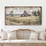 Toe Fish Art Vintage Barn Farmhouse Art Country Roads Take Me Home with rustic country barn farm landscape painting design. Rustic Primitive Country Cottage wall art handcrafted in durable high-quality canvas or outdoor weatherproof solid aluminum metal, handmade in the USA from start to finish! Beautiful, stylish and timeless seasonal wall decor. Handcrafted in the USA by ToeFishArt, and built to last a lifetime by the Toe Fish Art family artisans. This beautiful original peaceful farmhouse landscape scene adds unique eye-catching decor indoors or outdoors. Add instant outdoor curb appeal! Welcome entryway porch or living room fireplace hearth or mantel wall hanging or shelf sitter. Original, custom, personalized wall decor signs. Canvas, Wood or Metal. Rustic modern farmhouse, cottagecore, vintage, retro, industrial, Americana, primitive, country, coastal, minimalist. Toe Fish Art is a USA small family woman owned business making beautiful decor since 1997.