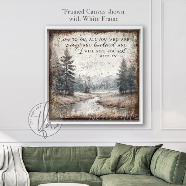 Toe Fish Art presents a vintage serene landscape painting featuring a forested river with a distant mountain range. This unique piece incorporates the Christian scripture from Matthew 11:28: "Come to Me, all who are weary, and I will give you rest." Blending rustic primitive country charm with cottage farmhouse style, this handcrafted artwork is available in durable high-quality framed canvas or outdoor weatherproof solid aluminum metal. Proudly made in the USA, each piece is designed to last a lifetime by the artisans at Toe Fish Art. This beautiful landscape painting enhances any decor, adding eye-catching appeal indoors or outdoors. It’s perfect for display in a porch, entryway, patio, lanai, deck, veranda, living room, fireplace hearth or mantel, dining room, or bedroom, or as a shelf sitter. A stunning reminder of Christian faith and God's love, this artwork fits various styles, including rustic modern farmhouse, cottagecore, vintage, retro, industrial, Americana, primitive, country, coastal, and minimalist. Toe Fish Art is a small family, woman-owned business, creating beautiful decor for almost three decades, since 1997!