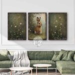 Toe Fish Art’s 3-piece set, or individual pieces, vintage Spring florals and bunny rabbit paintings, featuring our signature worn rustic style with soft garden greens and pink & white pastels, designed for seasonal Easter country cottage wall decor, available in framed canvas or outdoor metal artwork wall hangings in a huge variety of sizes and frame colors. These vintage-inspired paintings come as a set, or order individually, and feature a charmingly cute brown bunny rabbit amid a flower garden scene of soft greens with pink & white pastel wildflowers. Surrounded by delicate spring florals, the scene is set against a rustic background, perfect for seasonal spring or Easter decorations, or year round. This cottage-style artwork is available in framed canvas or outdoor metal, adding a sweet, cozy and warm touch to any space in your home. Blending rustic primitive country charm with authentic cottage farmhouse style, this unique handcrafted artwork is made of durable high-quality framed canvas or outdoor weatherproof solid aluminum metal, making it perfect for incorporating in any reorganizing, remodeling, redecorating or spring cleaning project, indoors or outdoors. Proudly made in the USA, each piece is designed to last a lifetime by the artisans at Toe Fish Art. These stunning vertically designed paintings enhance any decor, adding special eye-catching appeal. Mix and match the sizes and materials of this set to create the perfect unique touch for your space! This artwork is perfect for display in a porch, entryway, patio, lanai, deck, veranda, living room, fireplace hearth or mantel, kitchen, breakfast nook, or bedroom, or as a shelf sitter in any room. A vibrant reminder of renewal and rebirth for the spring season, this artwork fits various styles, including rustic modern farmhouse, cottagecore, vintage, retro, industrial, Americana, primitive, country, coastal, and minimalist. Toe Fish Art is a small family, woman-owned business, creating beautiful decor for almost three decades, since 1997!