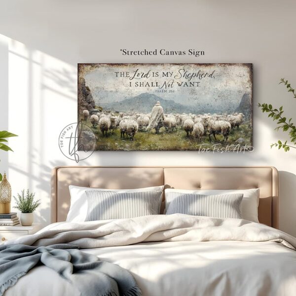 Toe Fish Art's artisan-made, faith-based, framed canvas or outdoor waterproof metal wall decor, expertly made with American-sourced materials. This premium, handcrafted piece features the painting of a shepherd dressed in flowing white garments walking peacefully among a herd of sheep in a lush green meadow. The scene is surrounded by majestic rocky mountains under a vibrant blue sky filled with puffy white and gray clouds, evoking a serene and pastoral atmosphere, with the hand-lettered Bible verse 'The Lord is My Shepherd I Shall Not Want' – Psalm 23:1. Built to last with genuine craftsmanship, this relevant decor adds rustic charm and heritage quality to any space. Made in the USA with durable, authentic materials for a beautiful and meaningful display. Rustic country charm meets Modern Farmhouse Cottagecore wall decor handcrafted in durable high-quality framed canvas or outdoor weatherproof solid aluminum metal, handmade in the USA from start to finish! Beautiful, stylish and timeless wall decor painting. Handcrafted in the USA by ToeFishArt, and built to last a lifetime by the Toe Fish Art family artisans. This beautiful original artwork adds unique eye-catching decor indoors or outdoors. Add instant outdoor curb appeal to your home or vacation house entryway! Perfect for your porch, entryway, patio, lanai, deck, garden, veranda, living room, fireplace hearth or mantel, wall hanging or shelf sitter, dining room, kitchen or bedroom. This painting is a beautiful reminder of Christian faith and God's love. Original, custom, personalized wall decor signs. Canvas, Wood or Metal. Rustic modern farmhouse, cottagecore, vintage, retro, industrial, Americana, primitive, country, coastal, minimalist. Toe Fish Art is a USA small family woman owned business making beautiful decor since 1997.
