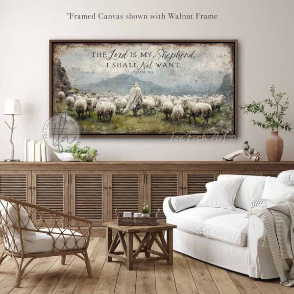 Toe Fish Art's artisan-made, faith-based, framed canvas or outdoor waterproof metal wall decor, expertly made with American-sourced materials. This premium, handcrafted piece features the painting of a shepherd dressed in flowing white garments walking peacefully among a herd of sheep in a lush green meadow. The scene is surrounded by majestic rocky mountains under a vibrant blue sky filled with puffy white and gray clouds, evoking a serene and pastoral atmosphere, with the hand-lettered Bible verse 'The Lord is My Shepherd I Shall Not Want' – Psalm 23:1. Built to last with genuine craftsmanship, this relevant decor adds rustic charm and heritage quality to any space. Made in the USA with durable, authentic materials for a beautiful and meaningful display. Rustic country charm meets Modern Farmhouse Cottagecore wall decor handcrafted in durable high-quality framed canvas or outdoor weatherproof solid aluminum metal, handmade in the USA from start to finish! Beautiful, stylish and timeless wall decor painting. Handcrafted in the USA by ToeFishArt, and built to last a lifetime by the Toe Fish Art family artisans. This beautiful original artwork adds unique eye-catching decor indoors or outdoors. Add instant outdoor curb appeal to your home or vacation house entryway! Perfect for your porch, entryway, patio, lanai, deck, garden, veranda, living room, fireplace hearth or mantel, wall hanging or shelf sitter, dining room, kitchen or bedroom. This painting is a beautiful reminder of Christian faith and God's love. Original, custom, personalized wall decor signs. Canvas, Wood or Metal. Rustic modern farmhouse, cottagecore, vintage, retro, industrial, Americana, primitive, country, coastal, minimalist. Toe Fish Art is a USA small family woman owned business making beautiful decor since 1997.