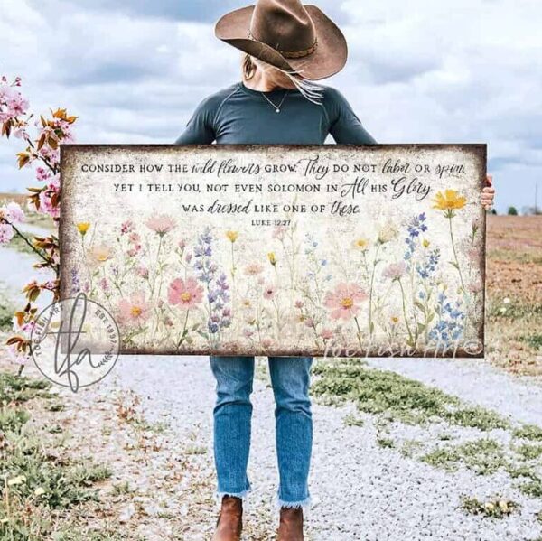 Toe Fish Art's artisan-made framed canvas or outdoor waterproof metal wall decor, expertly made with American-sourced materials. This premium, handcrafted piece features a timeless painting of pastel wildflowers with the hand-lettered Bible verse ‘Consider how the wildflowers grow’ (Luke 12:27). Built to last with genuine craftsmanship, it adds rustic charm and heritage quality to any space. Made in the USA with durable, authentic materials for a beautiful and meaningful display. Rustic Country and Modern Farmhouse wall decor handcrafted in durable high-quality framed canvas or outdoor weatherproof solid aluminum metal, handmade in the USA from start to finish! Beautiful, stylish and timeless floral wall decor painting. Handcrafted in the USA by ToeFishArt, and built to last a lifetime by the Toe Fish Art family artisans. This beautiful original artwork adds unique eye-catching decor indoors or outdoors. Add instant outdoor curb appeal to your home or vacation house entryway! Perfect for your porch, entryway, patio, lanai, deck, garden, veranda, living room, fireplace hearth or mantel, wall hanging or shelf sitter, dining room or bedroom. This painting is a beautiful reminder of Christian faith and God's love with the promise of Spring renewal. Original, custom, personalized wall decor signs. Canvas, Wood or Metal. Rustic modern farmhouse, cottagecore, vintage, retro, industrial, Americana, primitive, country, coastal, minimalist. Toe Fish Art is a USA small family woman owned business making beautiful decor since 1997.