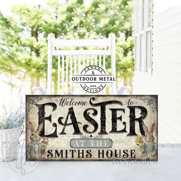 Toe Fish Art's Personalized Easter wall art sign with the text 'Welcome to Easter at the [Your Family Name],' featuring a vintage-style illustration of an antique bunny rabbit couple holding spring flowers, dressed in elegant spring garden party attire. The bunnies are framed by soft pastel accents, set against a worn rustic white wooden background with striking black lettering. This unique decoration is perfect for spring decor, designed for seasonal Easter country cottage display, available in framed canvas or outdoor metal. Toe Fish Art's wall hangings come in a huge variety of sizes and frame colors. This cottage-style artwork is available in framed canvas or waterproof metal, adding a sweet, cozy and warm touch to any space in your home, indoors or outside. Blending rustic primitive country charm with authentic cottage farmhouse style, this unique handcrafted artwork is made of durable high-quality framed canvas or outdoor weatherproof solid aluminum metal, making it perfect for incorporating in any reorganizing, remodeling, redecorating or spring cleaning project, indoors or outdoors. Proudly made in the USA, each piece is designed to last a lifetime by the artisans at Toe Fish Art. This stunning piece enhances any decor, adding special eye-catching holiday curb appeal. Mix and match your Toe Fish Art collection to create the perfect unique touch for your space! This artwork is perfect for display on a porch, entryway, patio, lanai, deck, veranda, living room, fireplace hearth or mantel, dining room, kitchen, or as a shelf sitter in any room. A vibrant reminder of renewal and rebirth for the spring season, this artwork fits various styles, including rustic modern farmhouse, cottagecore, vintage, retro, industrial, Americana, primitive, country, coastal, and minimalist. Toe Fish Art is a small family, woman-owned business, creating beautiful decor for almost three decades, since 1997!