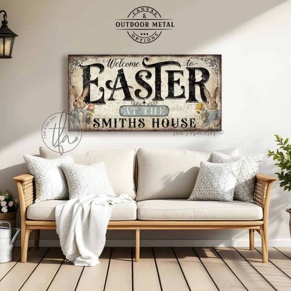 Toe Fish Art's Personalized Easter wall art sign with the text 'Welcome to Easter at the [Your Family Name],' featuring a vintage-style illustration of an antique bunny rabbit couple holding spring flowers, dressed in elegant spring garden party attire. The bunnies are framed by soft pastel accents, set against a worn rustic white wooden background with striking black lettering. This unique decoration is perfect for spring decor, designed for seasonal Easter country cottage display, available in framed canvas or outdoor metal. Toe Fish Art's wall hangings come in a huge variety of sizes and frame colors. This cottage-style artwork is available in framed canvas or waterproof metal, adding a sweet, cozy and warm touch to any space in your home, indoors or outside. Blending rustic primitive country charm with authentic cottage farmhouse style, this unique handcrafted artwork is made of durable high-quality framed canvas or outdoor weatherproof solid aluminum metal, making it perfect for incorporating in any reorganizing, remodeling, redecorating or spring cleaning project, indoors or outdoors. Proudly made in the USA, each piece is designed to last a lifetime by the artisans at Toe Fish Art. This stunning piece enhances any decor, adding special eye-catching holiday curb appeal. Mix and match your Toe Fish Art collection to create the perfect unique touch for your space! This artwork is perfect for display on a porch, entryway, patio, lanai, deck, veranda, living room, fireplace hearth or mantel, dining room, kitchen, or as a shelf sitter in any room. A vibrant reminder of renewal and rebirth for the spring season, this artwork fits various styles, including rustic modern farmhouse, cottagecore, vintage, retro, industrial, Americana, primitive, country, coastal, and minimalist. Toe Fish Art is a small family, woman-owned business, creating beautiful decor for almost three decades, since 1997!