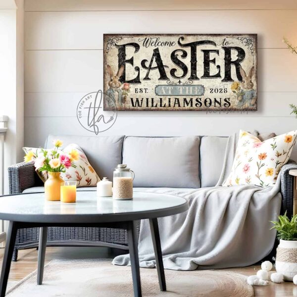 Toe Fish Art's Personalized Easter wall art sign with the text 'Welcome to Easter at the [Your Family Name],' featuring a vintage-style illustration of an antique bunny rabbit couple holding spring flowers, dressed in elegant spring garden party attire. The bunnies are framed by soft pastel accents, set against a worn rustic white wooden background with striking black lettering. This unique decoration is perfect for spring decor, designed for seasonal Easter country cottage display, available in framed canvas or outdoor metal. Toe Fish Art's wall hangings come in a huge variety of sizes and frame colors. This cottage-style artwork is available in framed canvas or waterproof metal, adding a sweet, cozy and warm touch to any space in your home, indoors or outside. Blending rustic primitive country charm with authentic cottage farmhouse style, this unique handcrafted artwork is made of durable high-quality framed canvas or outdoor weatherproof solid aluminum metal, making it perfect for incorporating in any reorganizing, remodeling, redecorating or spring cleaning project, indoors or outdoors. Proudly made in the USA, each piece is designed to last a lifetime by the artisans at Toe Fish Art. This stunning piece enhances any decor, adding special eye-catching holiday curb appeal. Mix and match your Toe Fish Art collection to create the perfect unique touch for your space! This artwork is perfect for display on a porch, entryway, patio, lanai, deck, veranda, living room, fireplace hearth or mantel, dining room, kitchen, or as a shelf sitter in any room. A vibrant reminder of renewal and rebirth for the spring season, this artwork fits various styles, including rustic modern farmhouse, cottagecore, vintage, retro, industrial, Americana, primitive, country, coastal, and minimalist. Toe Fish Art is a small family, woman-owned business, creating beautiful decor for almost three decades, since 1997!