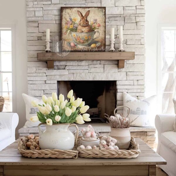 Toe Fish Art's vintage-inspired painting featuring a cute baby bunny rabbit sitting in a tea cup, surrounded by wildflowers and pastel Easter eggs. This square-shaped wall art showcases a charming cottage farmhouse style, perfect for enhancing Easter and spring decor. This artwork is available in framed canvas or outdoor metal, perfect for entryway, garden, kitchen, patio and spring decorations. Makes a charming fireplace mantel or hearth shelf sitter! Quaint and festive with a vintage-inspired cottage style. Toe Fish Art's artisan-made framed canvas or outdoor waterproof metal wall decor, expertly made with American-sourced materials. This premium, handcrafted piece can be customized to fit your style. Built to last with genuine craftsmanship, this nostalgic, heirloom decor adds rustic charm and heritage quality to any space. Made in the USA with durable, authentic materials for a beautiful and meaningful display to last year after year. Rustic country charm meets Modern Farmhouse Cottagecore wall decor handcrafted in durable high-quality framed canvas or outdoor weatherproof solid aluminum metal, handmade in the USA from start to finish! Beautiful, stylish and timeless wall decor artwork. Handcrafted in the USA by ToeFishArt, and built to last a lifetime by the Toe Fish Art family artisans. This beautiful original artwork adds unique eye-catching decor indoors or outdoors. Add instant outdoor holiday curb appeal to your home! Perfect for your porch, entryway, foyer, patio, lanai, deck, garden, veranda, kitchen, breakfast nook, or dining room. This special holiday decoration is a beautiful reminder of spring celebrations and renewal. Original, custom, personalized wall decor signs. Canvas, Wood or Metal. Rustic modern farmhouse, cottagecore, vintage, retro, industrial, Americana, primitive, country, coastal, minimalist. Toe Fish Art is a USA small family woman owned business making beautiful decor since 1997.
