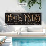Toe Fish Art's personalized, custom 'Pool & Patio' sign 2-piece set with Family Name and Established Date, featuring a classy vintage slate black design with knotty woodgrain style colored lettering. Available in framed canvas or outdoor waterproof metal print, this large-sized sign adds a unique touch to your outdoor space, perfect for showcasing your family name and date, special message, and popular sayings. This special 2-piece set is huge! – Available in large sizes starting at 10 feet wide! Toe Fish Art's artisan-made outdoor waterproof metal wall decor, expertly made with American-sourced materials. This premium, handcrafted 2-piece set can be customized to fit your style. Built to last with genuine craftsmanship, this lux decor adds high-end cottagecore charm and heritage quality to any space. Made in the USA with durable, authentic materials for a beautiful and meaningful display to last year after year. Modern Farmhouse Cottagecore wall decor handcrafted in durable high-quality outdoor weatherproof solid aluminum metal print, handmade in the USA from start to finish! Beautiful, stylish and timeless wall decor artwork. Handcrafted in the USA by ToeFishArt, and built to last a lifetime by the Toe Fish Art family artisans. This beautiful original artwork adds unique eye-catching decor indoors or outdoors. Perfect for your patio, lanai, deck, veranda, or backyard oasis. This special outdoor decoration is a beautiful reminder of outdoor living. Original, custom, personalized wall decor signs. Canvas, Wood or Metal. Rustic modern farmhouse, cottagecore, vintage, retro, industrial, Americana, primitive, country, coastal, minimalist. Toe Fish Art is a USA small family woman owned business making beautiful decor since 1997.
