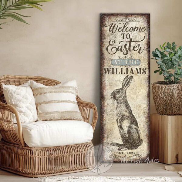 Toe Fish Art vintage-style 'Welcome to Easter' vertical porch leaner and greeter sign, personalized with family name and year. Features worn rustic white background and powder blue accents, with dark charcoal gray lettering and charming vintage bunny rabbit hand-drawn sketched artwork. Available in framed canvas or durable outdoor metal, perfect for entryways, gardens, patios or outdoor walkways. Toe Fish Art's artisan-made framed canvas or outdoor waterproof metal wall decor, expertly made with American-sourced materials. This premium, handcrafted piece can be customized to fit your style. Built to last with genuine craftsmanship, this nostalgic, heirloom decor adds rustic charm and heritage quality to any space. Made in the USA with durable, authentic materials for a beautiful and meaningful display to last year after year. Rustic country charm meets Modern Farmhouse Cottagecore wall decor handcrafted in durable high-quality framed canvas or outdoor weatherproof solid aluminum metal, handmade in the USA from start to finish! Beautiful, stylish and timeless wall decor artwork. Handcrafted in the USA by ToeFishArt, and built to last a lifetime by the Toe Fish Art family artisans. This beautiful original artwork adds unique eye-catching decor indoors or outdoors. Add instant outdoor holiday curb appeal to your home! Perfect for your porch, entryway, foyer, patio, lanai, deck, garden, veranda, kitchen or dining room. This special holiday decoration is a beautiful reminder of spring celebrations and renewal. Original, custom, personalized wall decor signs. Canvas, Wood or Metal. Rustic modern farmhouse, cottagecore, vintage, retro, industrial, Americana, primitive, country, coastal, minimalist. Toe Fish Art is a USA small family woman owned business making beautiful decor since 1997.