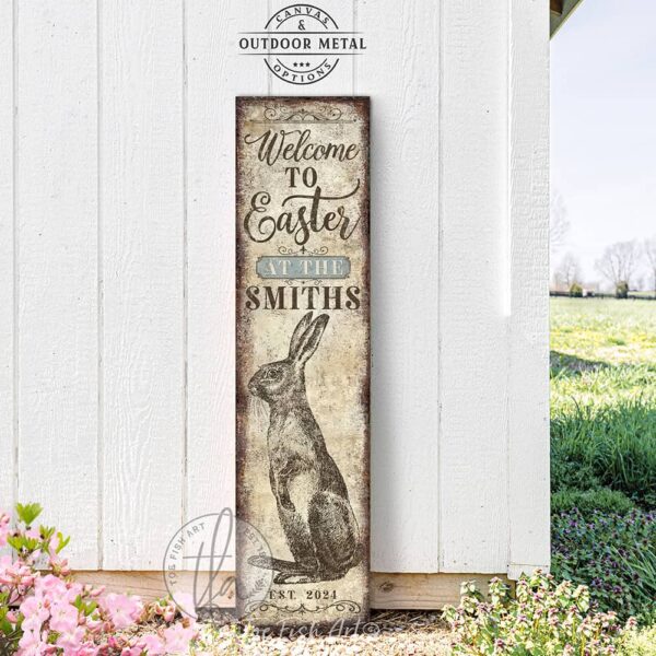 Toe Fish Art vintage-style 'Welcome to Easter' vertical porch leaner and greeter sign, personalized with family name and year. Features worn rustic white background and powder blue accents, with dark charcoal gray lettering and charming vintage bunny rabbit hand-drawn sketched artwork. Available in framed canvas or durable outdoor metal, perfect for entryways, gardens, patios or outdoor walkways. Toe Fish Art's artisan-made framed canvas or outdoor waterproof metal wall decor, expertly made with American-sourced materials. This premium, handcrafted piece can be customized to fit your style. Built to last with genuine craftsmanship, this nostalgic, heirloom decor adds rustic charm and heritage quality to any space. Made in the USA with durable, authentic materials for a beautiful and meaningful display to last year after year. Rustic country charm meets Modern Farmhouse Cottagecore wall decor handcrafted in durable high-quality framed canvas or outdoor weatherproof solid aluminum metal, handmade in the USA from start to finish! Beautiful, stylish and timeless wall decor artwork. Handcrafted in the USA by ToeFishArt, and built to last a lifetime by the Toe Fish Art family artisans. This beautiful original artwork adds unique eye-catching decor indoors or outdoors. Add instant outdoor holiday curb appeal to your home! Perfect for your porch, entryway, foyer, patio, lanai, deck, garden, veranda, kitchen or dining room. This special holiday decoration is a beautiful reminder of spring celebrations and renewal. Original, custom, personalized wall decor signs. Canvas, Wood or Metal. Rustic modern farmhouse, cottagecore, vintage, retro, industrial, Americana, primitive, country, coastal, minimalist. Toe Fish Art is a USA small family woman owned business making beautiful decor since 1997.