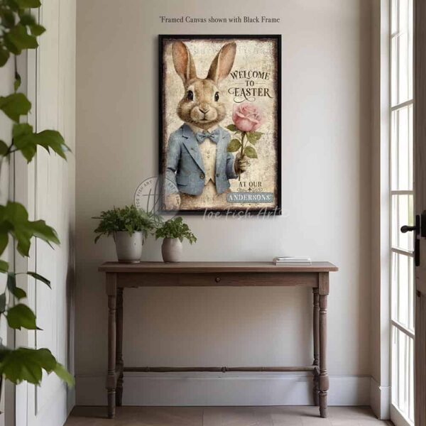 Toe Fish Art vintage-style 'Welcome to Easter' vertical entryway porch greeter sign, personalized with family name or other phrase. Features worn rustic white background and powder blue accents, with dark charcoal gray lettering and charming vintage bunny rabbit wearing a powder blue and white tuxedo holding a pink rose hand-drawn sketched artwork. Available in framed canvas or durable outdoor metal, perfect for porches, entryways, gardens, patios or outdoor walkways. Toe Fish Art's artisan-made framed canvas or outdoor waterproof metal wall decor, expertly made with American-sourced materials. This premium, handcrafted piece can be customized to fit your style. Built to last with genuine craftsmanship, this nostalgic, heirloom decor adds rustic charm and heritage quality to any space. Made in the USA with durable, authentic materials for a beautiful and meaningful display to last year after year. Rustic country charm meets Modern Farmhouse Cottagecore wall decor handcrafted in durable high-quality framed canvas or outdoor weatherproof solid aluminum metal, handmade in the USA from start to finish! Beautiful, stylish and timeless wall decor artwork. Handcrafted in the USA by ToeFishArt, and built to last a lifetime by the Toe Fish Art family artisans. This beautiful original artwork adds unique eye-catching decor indoors or outdoors. Add instant outdoor holiday curb appeal to your home! Perfect for your porch, entryway, foyer, patio, lanai, deck, garden, veranda, kitchen or dining room. This special holiday decoration is a beautiful reminder of spring celebrations and renewal. Original, custom, personalized wall decor signs. Canvas, Wood or Metal. Rustic modern farmhouse, cottagecore, vintage, retro, industrial, Americana, primitive, country, coastal, minimalist. Toe Fish Art is a USA small family woman owned business making beautiful decor since 1997.