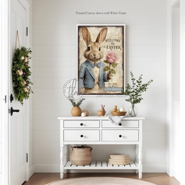 Toe Fish Art vintage-style 'Welcome to Easter' vertical entryway porch greeter sign, personalized with family name or other phrase. Features worn rustic white background and powder blue accents, with dark charcoal gray lettering and charming vintage bunny rabbit wearing a powder blue and white tuxedo holding a pink rose hand-drawn sketched artwork. Available in framed canvas or durable outdoor metal, perfect for porches, entryways, gardens, patios or outdoor walkways. Toe Fish Art's artisan-made framed canvas or outdoor waterproof metal wall decor, expertly made with American-sourced materials. This premium, handcrafted piece can be customized to fit your style. Built to last with genuine craftsmanship, this nostalgic, heirloom decor adds rustic charm and heritage quality to any space. Made in the USA with durable, authentic materials for a beautiful and meaningful display to last year after year. Rustic country charm meets Modern Farmhouse Cottagecore wall decor handcrafted in durable high-quality framed canvas or outdoor weatherproof solid aluminum metal, handmade in the USA from start to finish! Beautiful, stylish and timeless wall decor artwork. Handcrafted in the USA by ToeFishArt, and built to last a lifetime by the Toe Fish Art family artisans. This beautiful original artwork adds unique eye-catching decor indoors or outdoors. Add instant outdoor holiday curb appeal to your home! Perfect for your porch, entryway, foyer, patio, lanai, deck, garden, veranda, kitchen or dining room. This special holiday decoration is a beautiful reminder of spring celebrations and renewal. Original, custom, personalized wall decor signs. Canvas, Wood or Metal. Rustic modern farmhouse, cottagecore, vintage, retro, industrial, Americana, primitive, country, coastal, minimalist. Toe Fish Art is a USA small family woman owned business making beautiful decor since 1997.