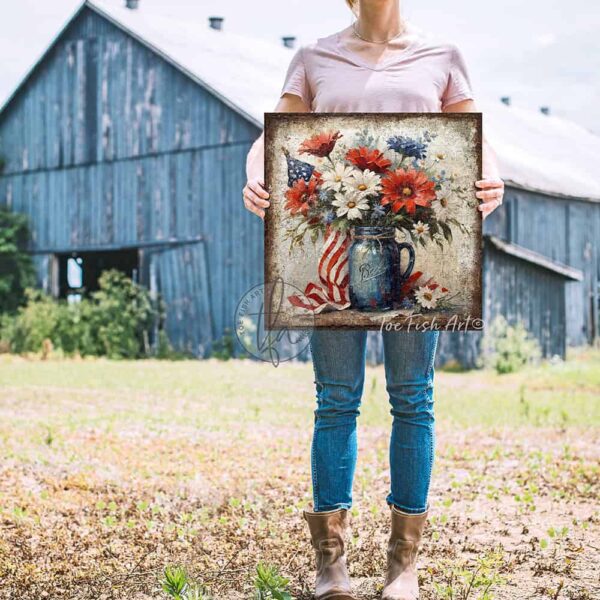 Toe Fish Art's vintage-inspired 4th of July patriotic wall art painting featuring a beautiful antique blue mason jar filled with red, white, and blue flowers blooming, with patriotic accents, surrounded by the American flag, perfect for Memorial Day, Independence Day, Summer, and Veterans Day decorations. This square-shaped wall art displays a charming cottage farmhouse style, perfect for enhancing your American pride USA themed decor. This artwork is available in framed canvas or outdoor metal, perfect for porch, entryway, garden, kitchen, guest bedroom, patio and living room decorations. Makes a charming fireplace mantel or hearth shelf sitter! Nostalgic and festive with a vintage country cottagecore style. Toe Fish Art's artisan-made framed canvas or outdoor waterproof metal wall decor, expertly made with All-American-sourced materials. This premium, handcrafted piece can be customized to fit your style. Built to last with genuine craftsmanship, this nostalgic, heirloom decor adds rustic charm and heritage quality to any space. Made in the USA with durable, authentic materials for a beautiful and meaningful display to last year after year. Rustic country charm meets Modern Farmhouse Cottagecore wall decor handcrafted in durable high-quality framed canvas or outdoor weatherproof solid aluminum metal, handmade in the USA from start to finish! Beautiful, stylish and timeless wall decor artwork. Handcrafted in the USA by ToeFishArt, and built to last a lifetime by the Toe Fish Art family artisans. This beautiful original artwork adds unique eye-catching decor indoors or outdoors. Add instant outdoor holiday curb appeal to your home! This special summer holiday decoration is a beautiful reminder of summer fun and relaxation. Original, custom, personalized wall decor signs. Canvas, Wood or Metal. Rustic modern farmhouse, cottagecore, vintage, retro, industrial, Americana, primitive, country, coastal, minimalist. Toe Fish Art is a USA small family woman owned business making beautiful decor since 1997.