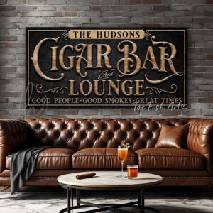 Toe Fish Art's personalized, custom Cigar Bar and Lounge sign featuring the phrase 'Good People-Good Smokes-Great Times', in a vintage, industrial, retro style. Available in framed canvas or waterproof and rustproof aluminum metal. This printed sign showcases a vintage slate black background with woodgrain-style lettering in a detailed original design. Ideal for upgrading your man cave, basement bar, game room, whiskey-bourbon bar, theater & lounge, or outdoor entertaining space decor. Customized sign, personalized with family name or favorite saying and custom wording options. Available in a huge array of sizes. Toe Fish Art's artisan-made wall decor is expertly made with American-sourced materials. This premium, handcrafted piece can be customized to fit your style. Built to last with genuine craftsmanship, this heirloom decor adds rustic cottage charm and heritage quality to any space. Made in the USA with durable, authentic materials for a beautiful and meaningful display to last year after year. Modern Farmhouse Cottagecore wall decor handcrafted in durable high-quality framed canvas or indoor-outdoor weatherproof solid aluminum metal, handmade in the USA from start to finish! Beautiful, stylish and timeless wall decor artwork. Handmade in the USA by ToeFishArt, and built to last a lifetime by the Toe Fish Art family artisans. This beautiful original artwork adds unique eye-catching decor indoors or outdoors. Perfect for your game room, man cave, theater, sports bar, basement bar, garage bar, patio, lanai, deck, or any outdoor living space. This special decoration is a fun way to celebrate with friends or guy hangout nights. Original, custom, personalized wall decor signs. Canvas, Wood or Metal. Rustic modern farmhouse, cottagecore, vintage, retro, industrial, Americana, primitive, country, coastal, minimalist. Toe Fish Art is a USA small family woman owned business making beautiful decor since 1997.