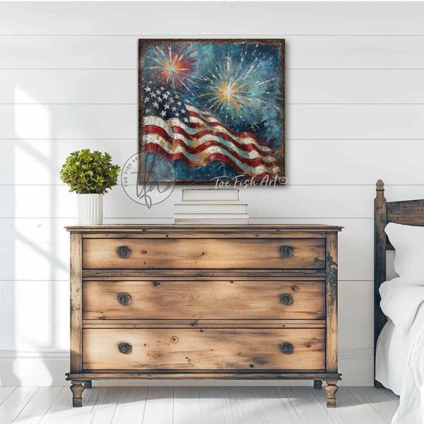 Toe Fish Art's vintage-inspired 4th of July patriotic wall art painting featuring a large American flag waving against a blue evening sky, as fireworks burst and sparkle overhead! You'll treasure the vibrant red, white, and blue stars and stripes in this meaningful work of art that's perfect for Independence Day and Summer decorations, or show off your American pride all year long! This square-shaped wall art displays a charming cottage farmhouse style, perfect for enhancing your Memorial Day, Fourth of July and Summer decor. This artwork is available in framed canvas or outdoor metal, perfect for porch, entryway, garden, kitchen, guest bedroom, patio and living room decorations. Makes a charming fireplace mantel or hearth shelf sitter! Quaint and festive with a vintage-inspired cottagecore style. Toe Fish Art's artisan-made framed canvas or outdoor waterproof metal wall decor, expertly made with All-American-sourced materials. This premium, handcrafted piece can be customized to fit your style. Built to last with genuine craftsmanship, this nostalgic, heirloom decor adds rustic charm and heritage quality to any space. Made in the USA with durable, authentic materials for a beautiful and meaningful display to last year after year. Rustic country charm meets Modern Farmhouse Cottagecore wall decor handcrafted in durable high-quality framed canvas or outdoor weatherproof solid aluminum metal, handmade in the USA from start to finish! Beautiful, stylish and timeless wall decor artwork. Handcrafted in the USA by ToeFishArt, and built to last a lifetime by the Toe Fish Art family artisans. This beautiful original artwork adds unique eye-catching decor indoors or outdoors. Add instant outdoor holiday curb appeal to your home! This special summer holiday decoration is a beautiful reminder of summer fun, family time, and relaxation. Original, custom, personalized wall decor signs. Canvas, Wood or Metal. Rustic modern farmhouse, cottagecore, vintage, retro, industrial, Americana, primitive, country, coastal, minimalist. Toe Fish Art is a USA small family woman owned business making beautiful decor since 1997.