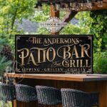 Personalized Welcome to the Patio Bar and Grill custom outdoor sign by Toe Fish Art, handmade in the USA in waterproof metal or framed canvas, vintage black and rustic gold, personalizable name, fun sayings like Sipping-Grilling-Chilling or your own custom text. Charming outdoor kitchen, bar, lounge, patio, lanai, porch, or pool deck spa decor. Ideal for upgrading your outdoor summer vibe. Built to last with genuine craftsmanship, this authentic sign adds classic charm and heritage quality to any space.