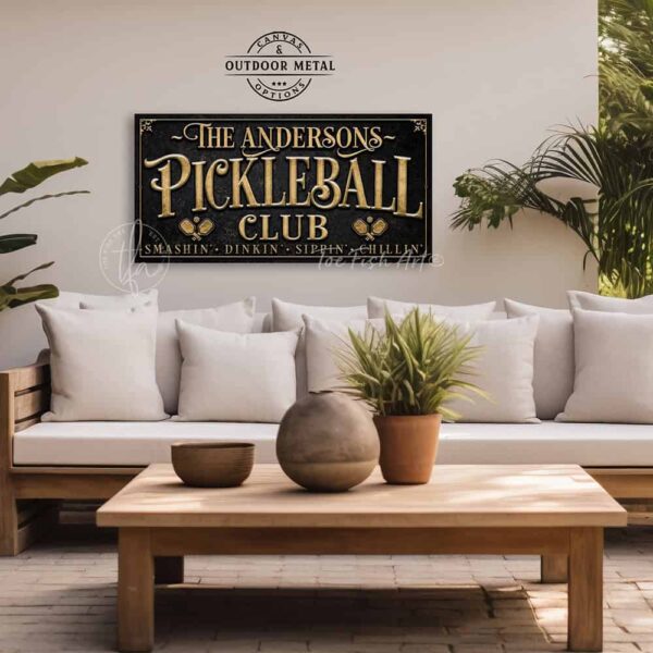 Toe Fish Art’s personalized "Pickleball Club” sign features the phrase "Smashin' Dinkin' Sippin' Chillin’" in rustic gold style lettering on a vintage slate black background. Available as a beautiful framed canvas sign or durable and sleek outdoor metal sign, this custom wall art decor adds humor and charm to your game space or post-play lounge area. Made in America and built to last, perfect for pickleball lovers, sports decor, and custom man cave or backyard court accents. This premium printed sign showcases a detailed, original design ideal for upgrading your sports bar, game room, court-side seating, outdoor entertaining space, or backyard decor. Customized sign, personalized with family name or favorite saying and custom wording options. Available in a huge array of sizes, Toe Fish Art's artisan-made wall decor is expertly made in America with American-sourced materials. This high-end, handcrafted piece can be customized to fit your style! Built to last with genuine craftsmanship, this heirloom decor adds rustic cottage charm and heritage quality to any space. Made in the USA with durable, authentic materials for a beautiful and meaningful display to last year after year. Modern Farmhouse Cottagecore wall decor handcrafted in durable high-quality framed canvas or indoor-outdoor weatherproof solid aluminum metal, handmade in the USA from start to finish! Beautiful, stylish and timeless wall decor artwork. Handmade in the USA by ToeFishArt, and built to last a lifetime by the Toe Fish Art family artisans. This beautiful original artwork adds unique eye-catching decor indoors or outdoors. Perfect for your game room, man cave, sports bar post-game lounge, basement bar, garage bar, patio, lanai, deck, or any outdoor living space. This special decoration is a fun way to celebrate your favorite game with friends. Original, custom, personalized wall decor signs. Canvas, Wood or Metal. Rustic modern farmhouse, cottagecore, vintage, retro, industrial, Americana, primitive, country, coastal, minimalist. Toe Fish Art is a USA small family woman owned business making beautiful decor since 1997.